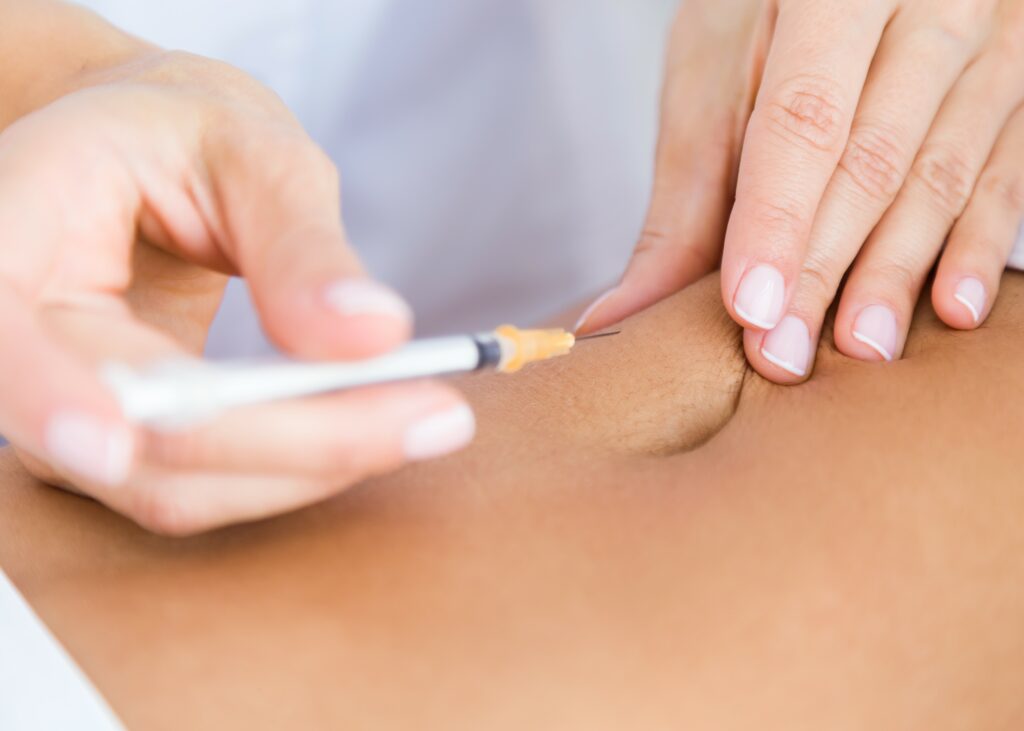 "Healthcare provider preparing a weight loss injection for a patient."