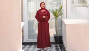 Cherry maroon abaya dress is worny by a lady