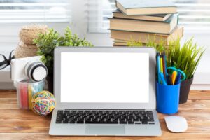 work-space-laptop-blank-screen-wooden-table_93675-128561